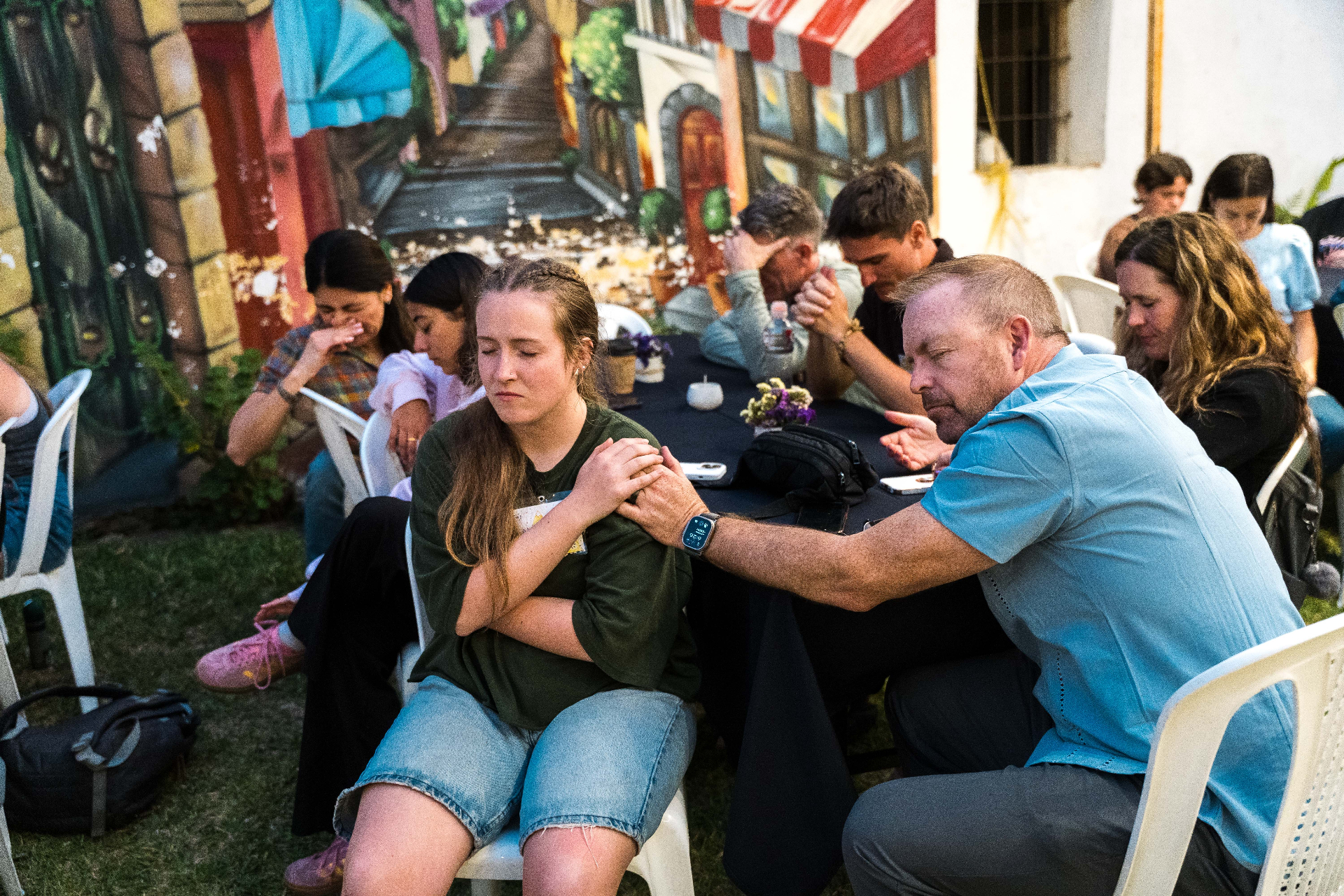 Parent praying with their child on a Parent Vision Trip in Guatemala